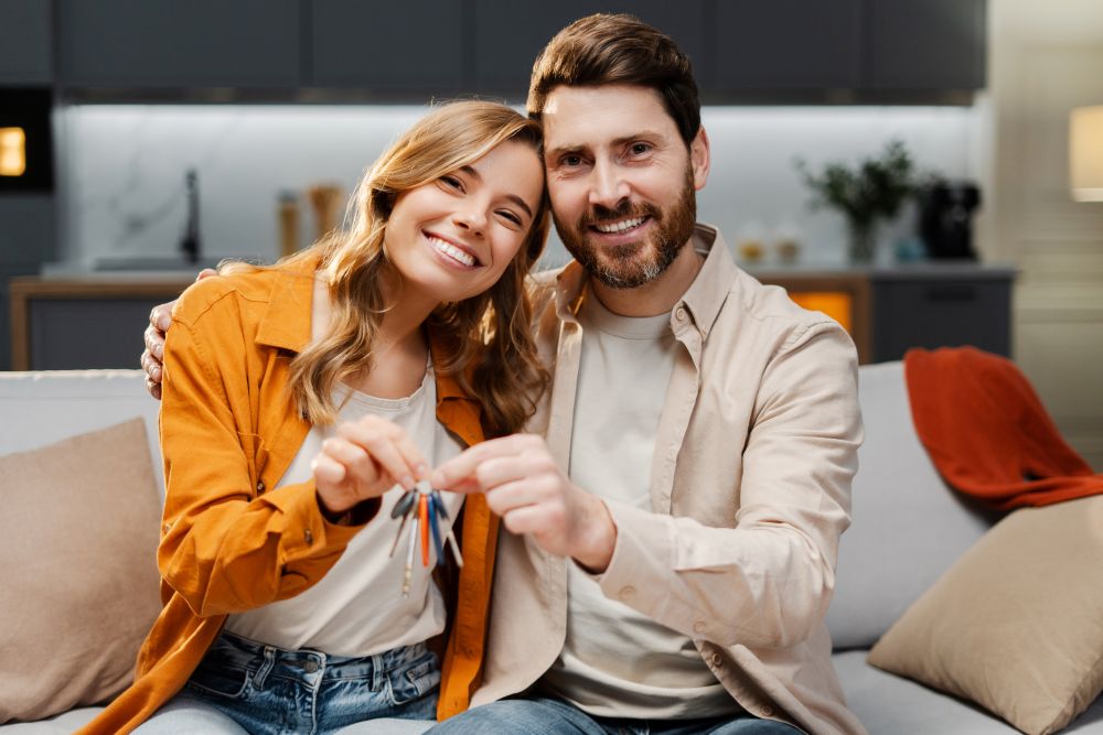 Couple buying home and noting the hidden costs